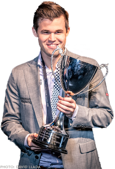 Magnus Carlsen holding a trophy